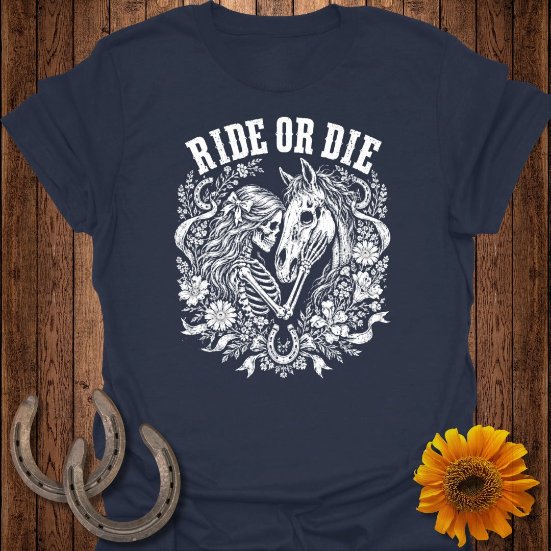 Dark navy t-shirt with a skeleton and horse graphic, surrounded by floral elements and text.