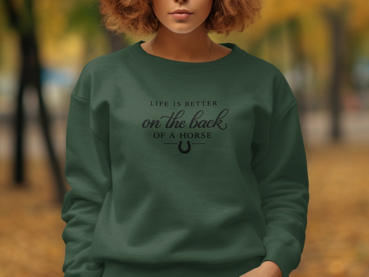 Dark green sweatshirt with "Life is Better on the Back of a Horse" text.