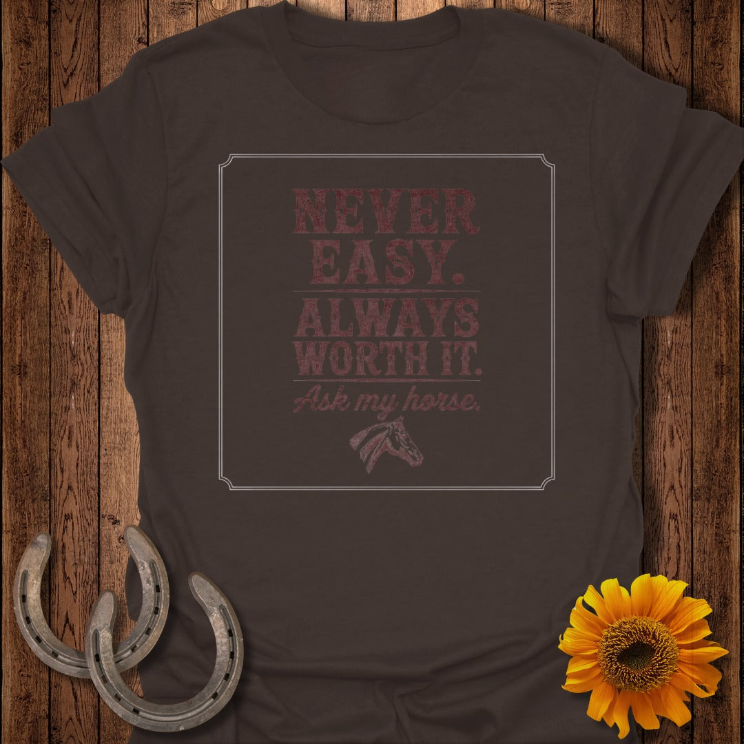 Brown t-shirt with "Never Easy. Always Worth It. Ask my horse." and horse graphic.