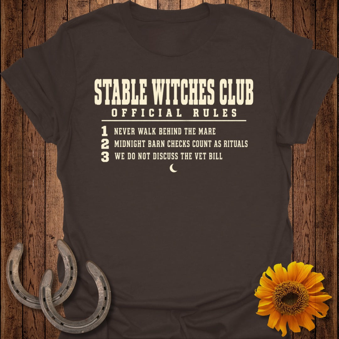 T-shirt with "Stable Witches Club Official Rules" and numbered rules.