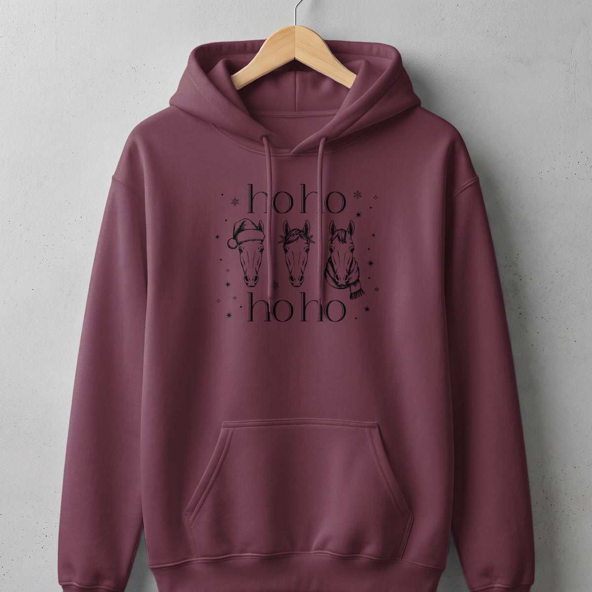 Maroon hoodie with "ho ho" text and three horses with Christmas details.
