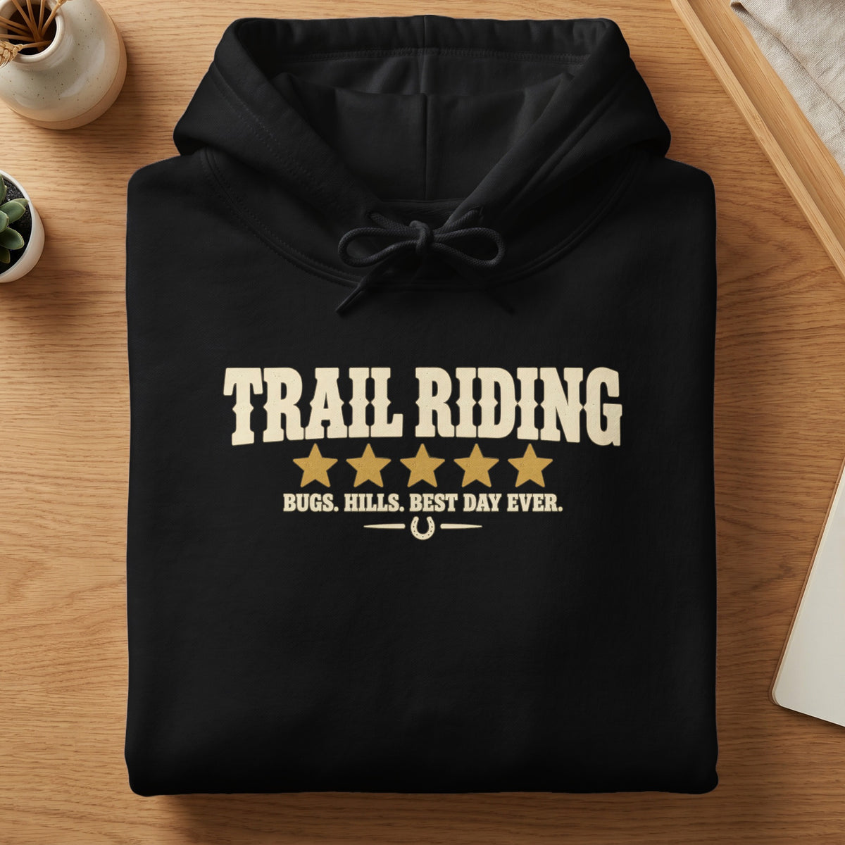 Black hoodie with "TRAIL RIDING" text, stars, and "BUGS. HILLS. BEST DAY EVER."