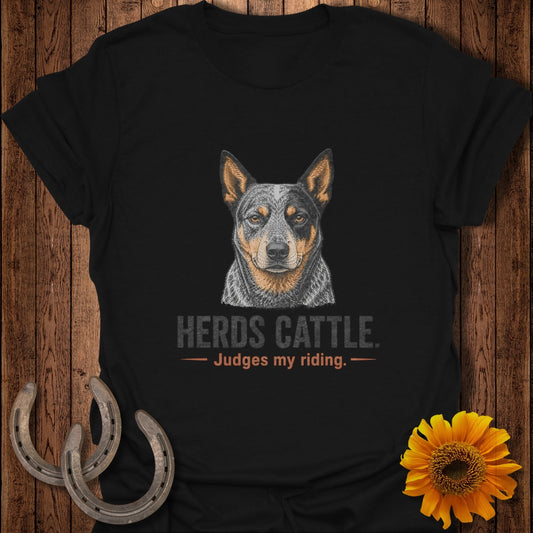 Black t-shirt with Australian Cattle Dog illustration and text "Herds Cattle. Judges my riding."