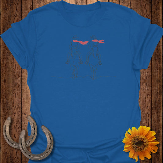 Blue t-shirt with line art of two cowboys on horseback with red scarves.