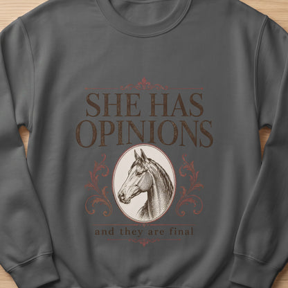 Dark gray sweatshirt with a horse head illustration and text "SHE HAS OPINIONS and they are final."
