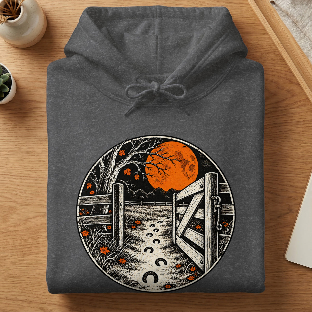 Dark grey hoodie with a circular graphic of a moonlit farm scene.