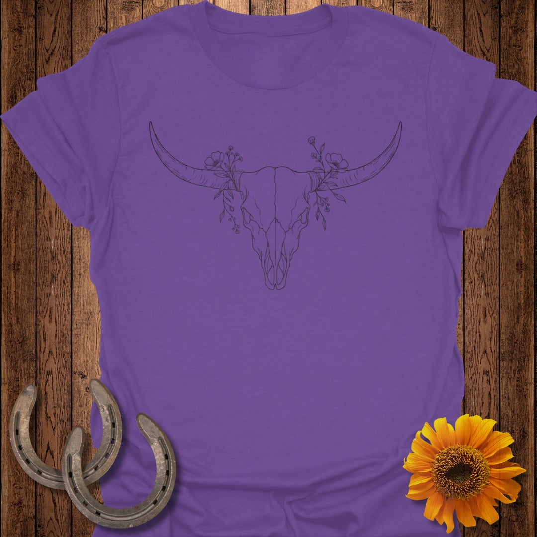 Purple t-shirt with a line drawing of a floral bull skull.