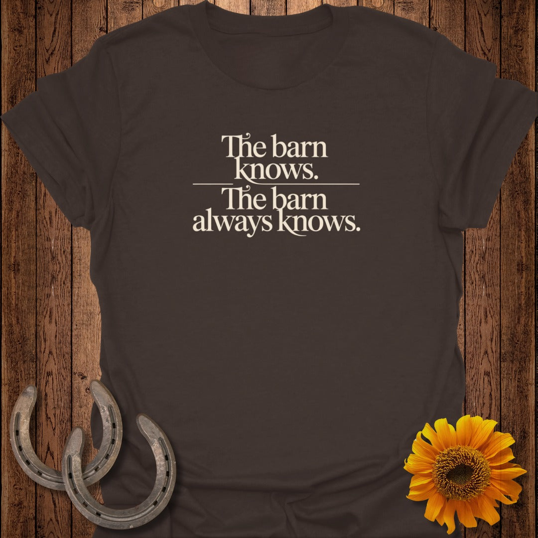 Dark brown t-shirt with white text: "The barn knows. The barn always knows."