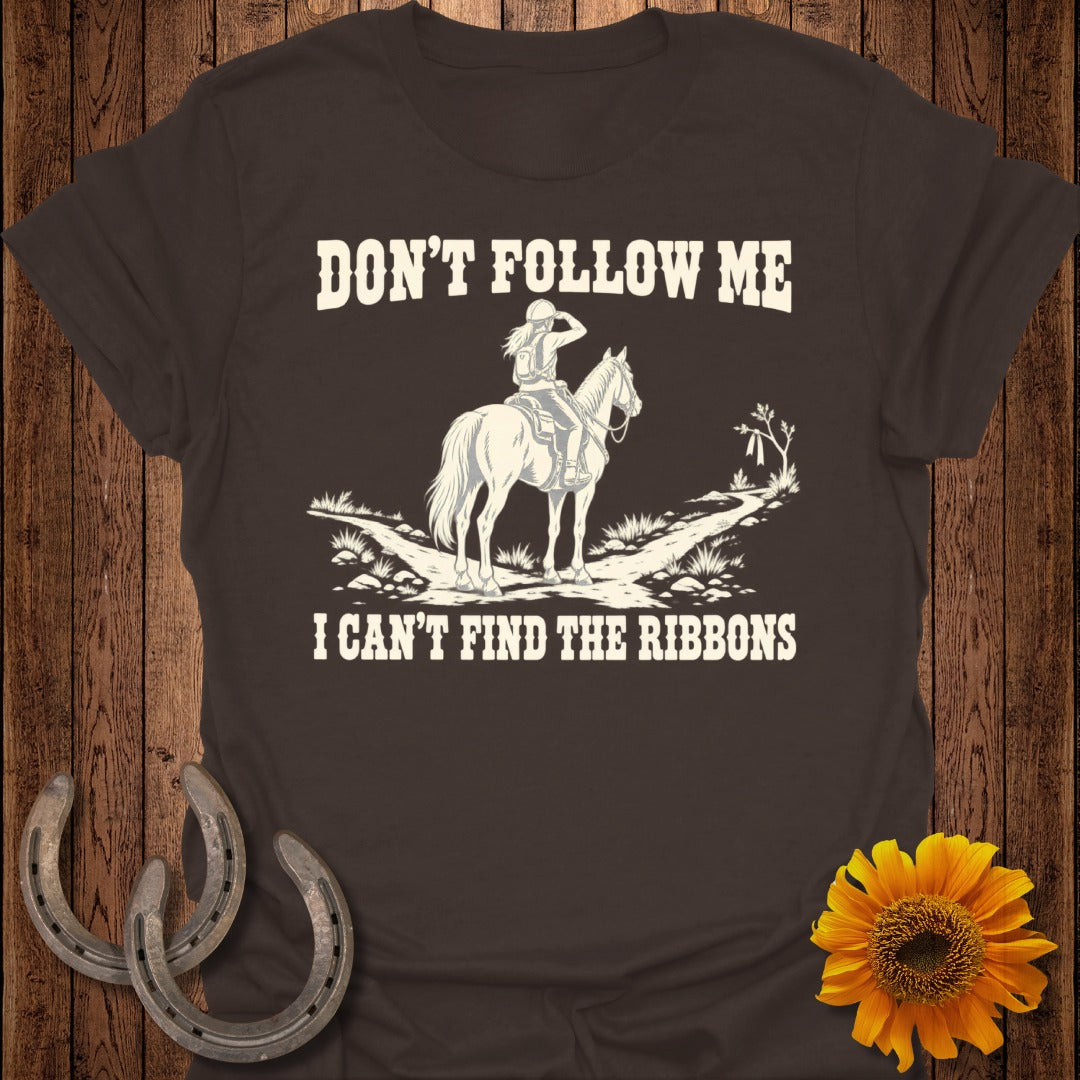 Brown t-shirt with "Don't Follow Me I Can't Find The Ribbons" text and horse rider graphic.