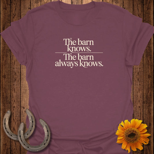 Burgundy t-shirt with "The barn knows. The barn always knows." text.