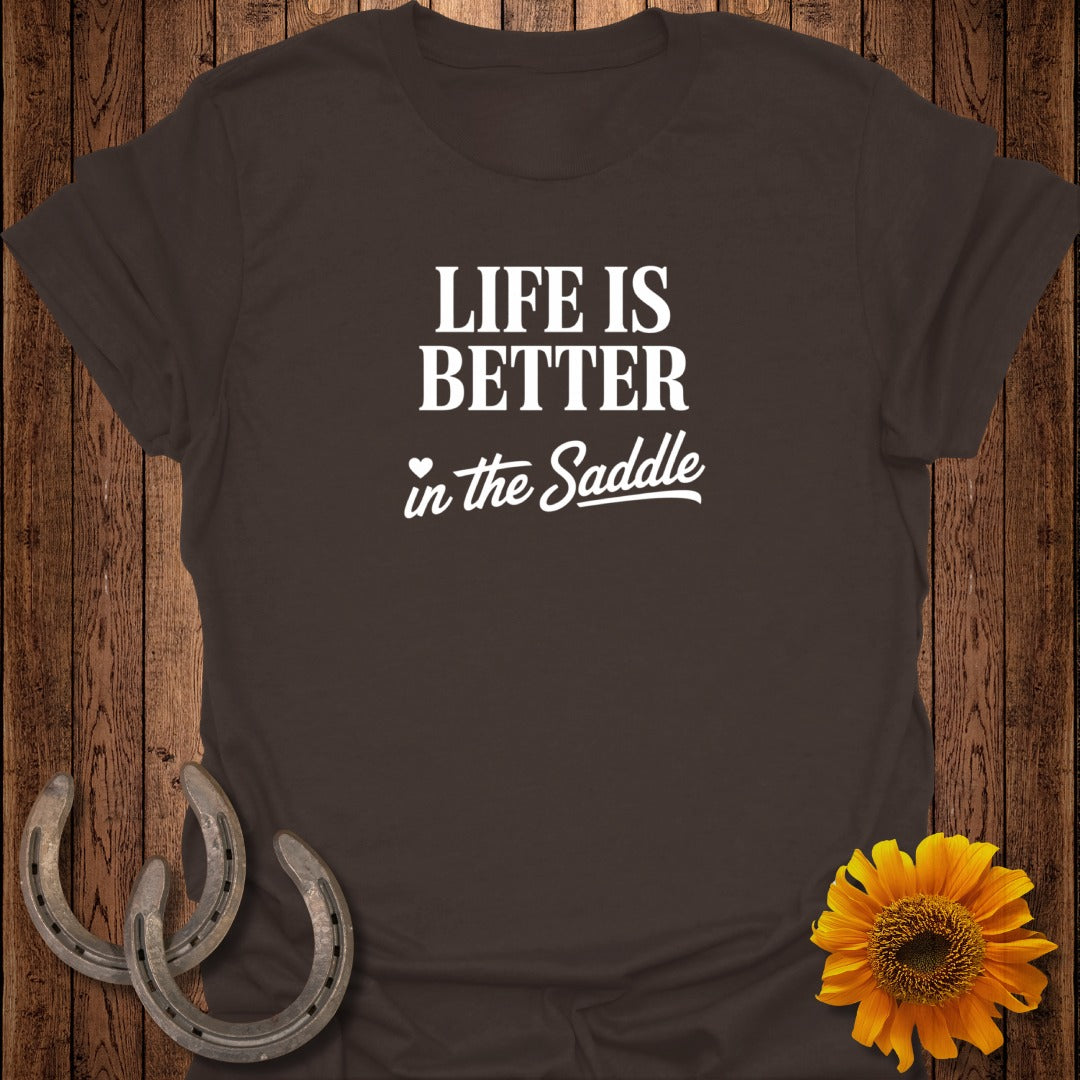 Brown t-shirt with white text "LIFE IS BETTER in the Saddle".