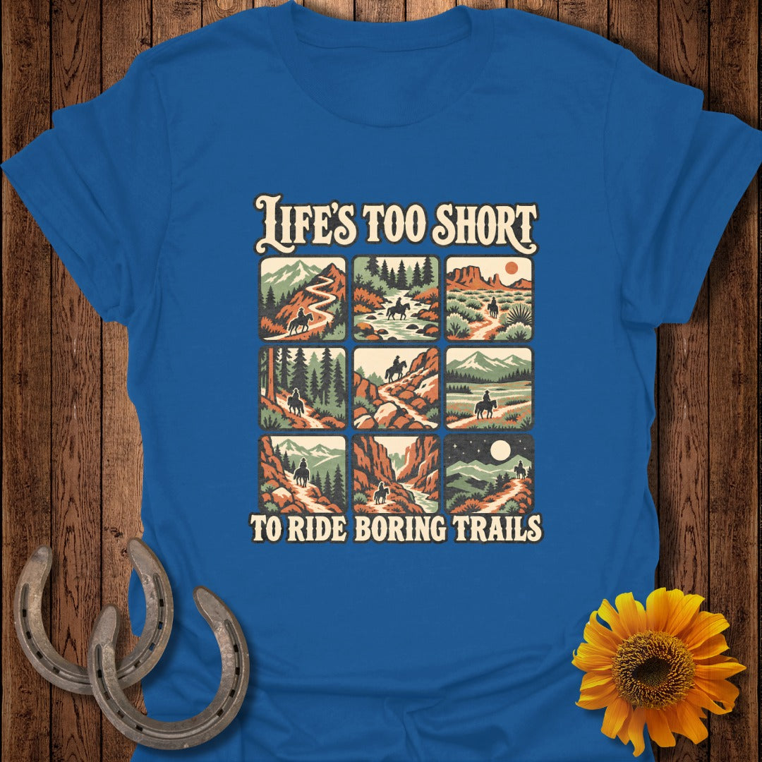 Blue t-shirt with "Life's Too Short To Ride Boring Trails" and nine scenes of horseback riding.
