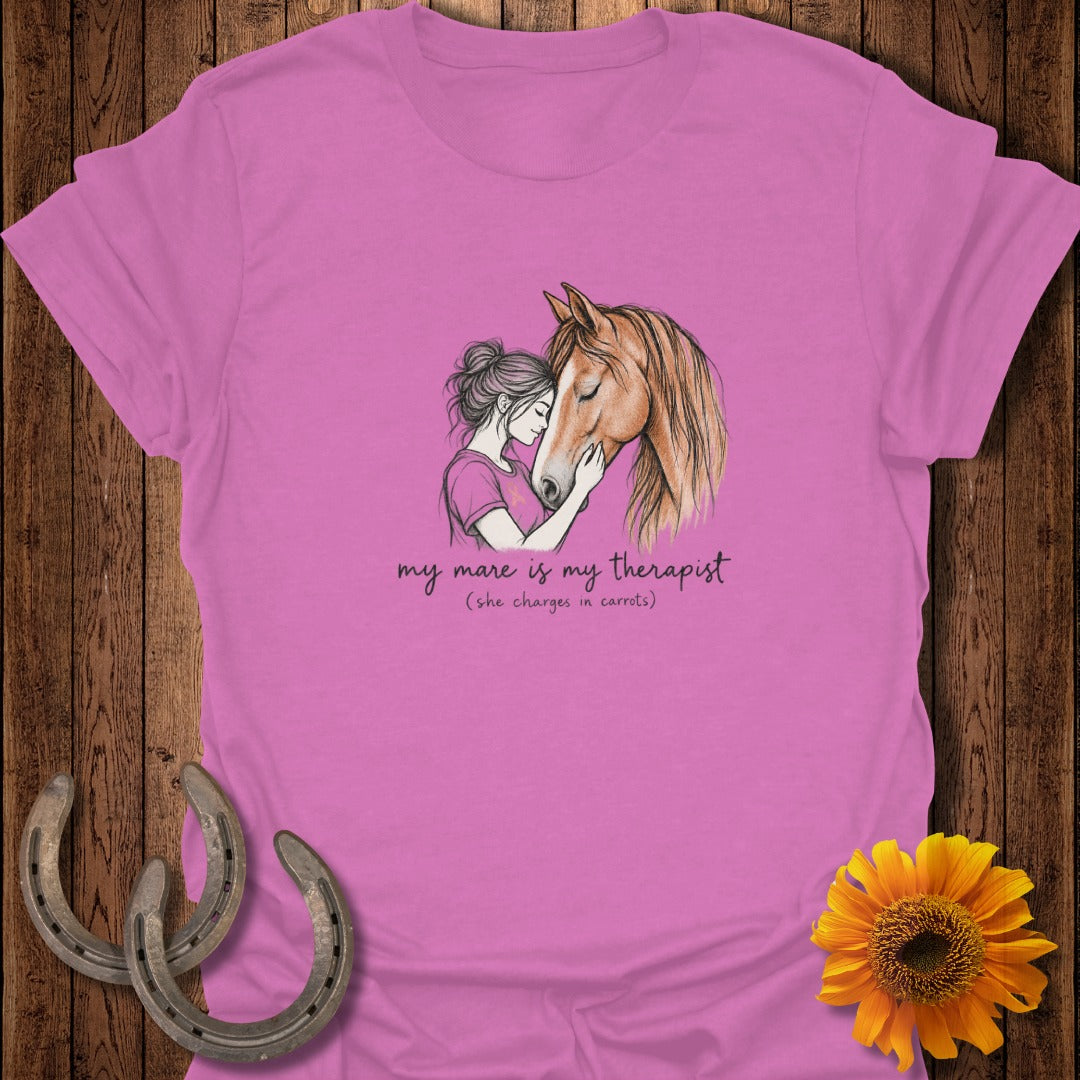 Pink t-shirt with illustration of woman hugging horse and text "my mare is my therapist".