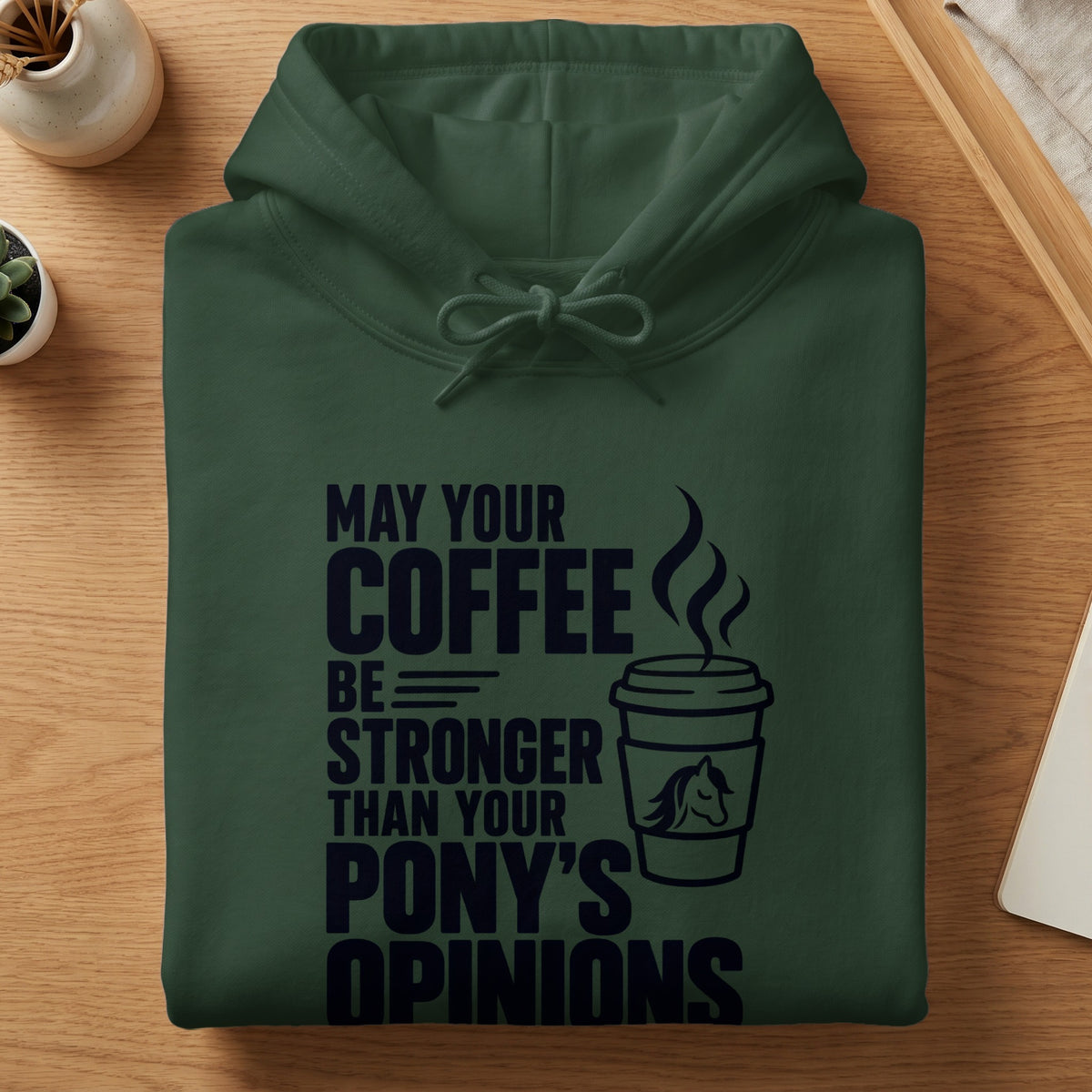 Dark green hoodie with "May your coffee be stronger than your pony's opinions" text.