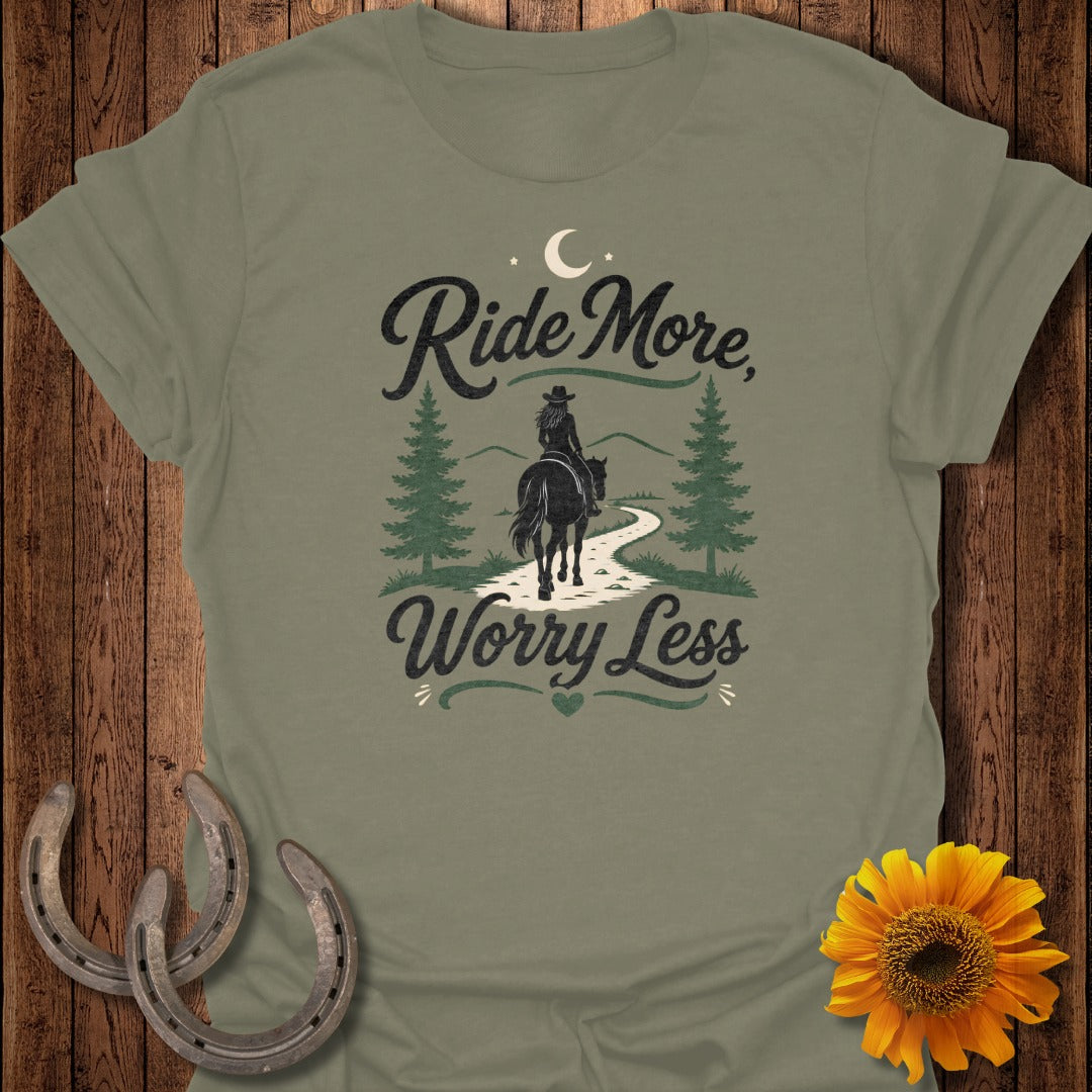 T-shirt with "Ride More, Worry Less" text, horse and rider on path.