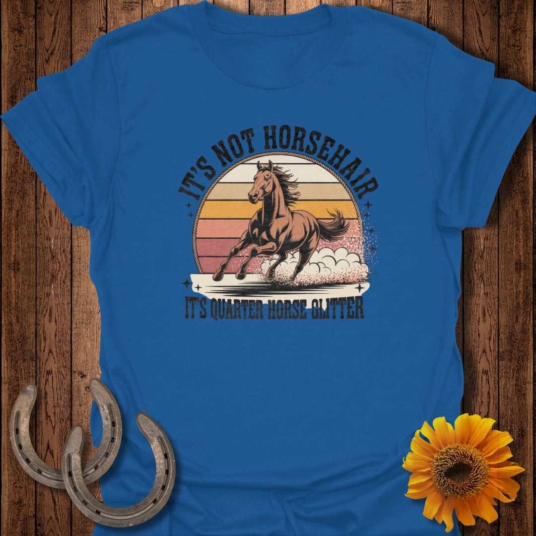 Blue t-shirt with a running horse graphic and text: "It's Not Horsehair, It's Quarter Horse Glitter."