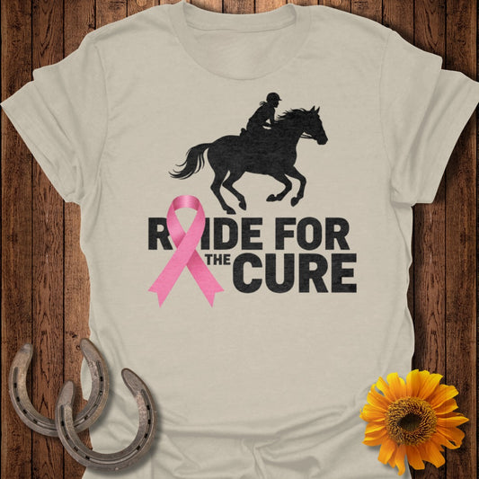 Black silhouette of a horse and rider with "RIDE FOR THE CURE" text and pink ribbon.