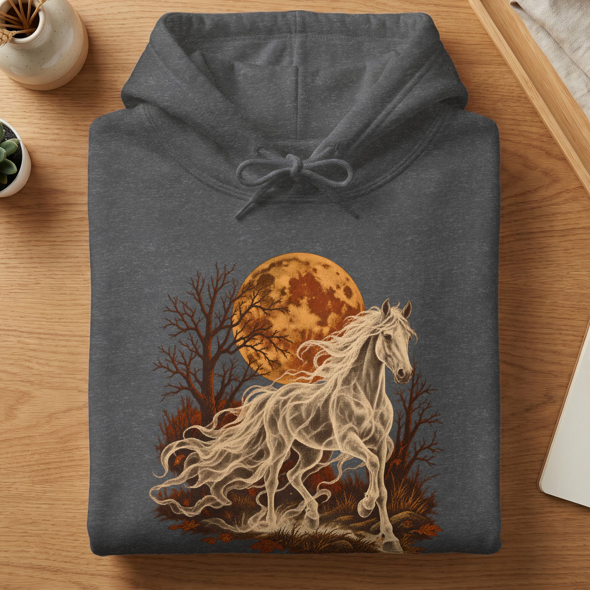 Dark gray hoodie with a white spectral horse running in front of an orange moon and trees.