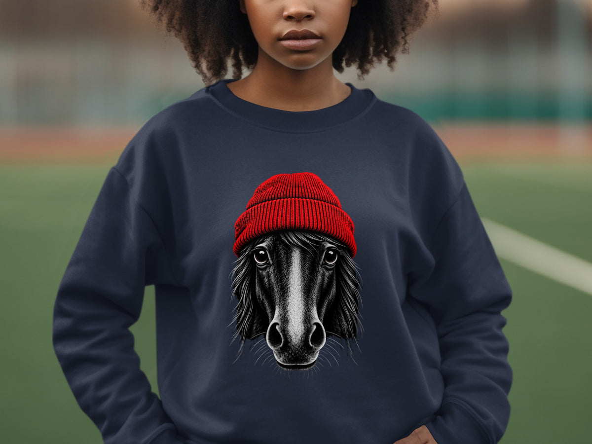 A dark blue crewneck sweatshirt featuring a graphic of a horse wearing a red beanie.