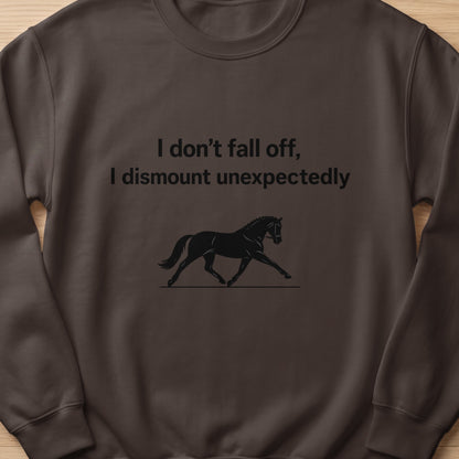 Brown sweatshirt with black text and horse graphic: "I don't fall off, I dismount unexpectedly".