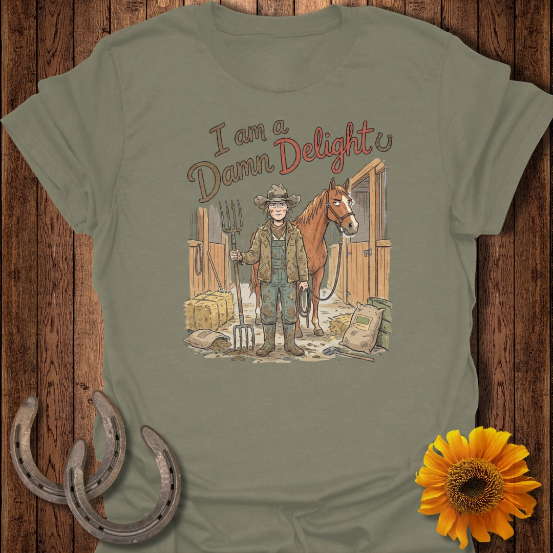 T-shirt with woman in barn holding pitchfork, horse behind her, text "I am a Damn Delight."