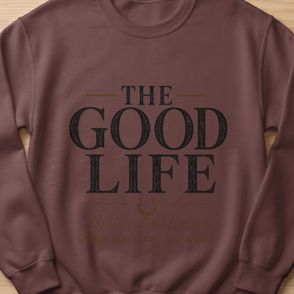 Brown sweatshirt with "The Good Life" and "Smells Like Leather, Hay, and Poor Decisions" text.