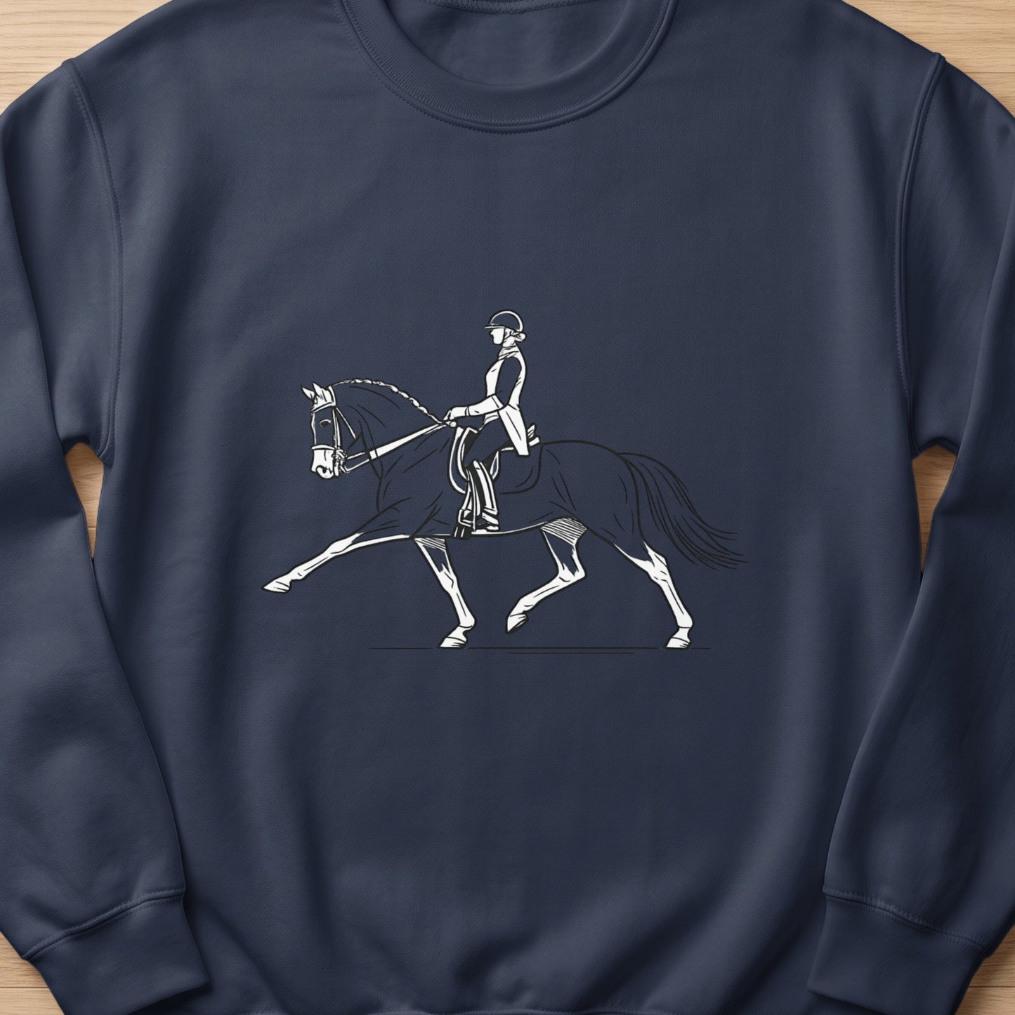 Line art of a rider on a horse performing a dressage movement.