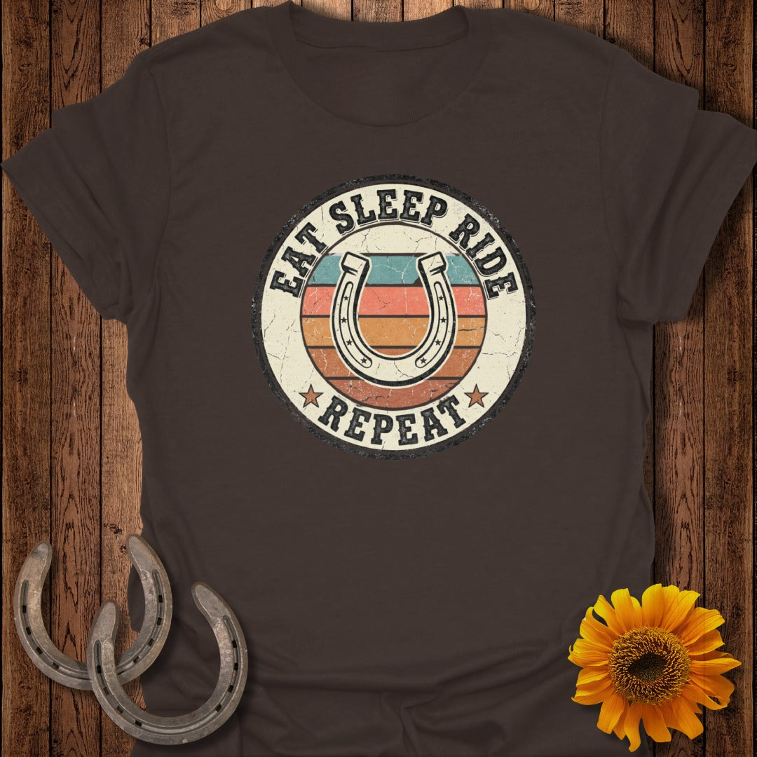 Brown t-shirt with a horseshoe graphic and "Eat Sleep Ride Repeat" text.