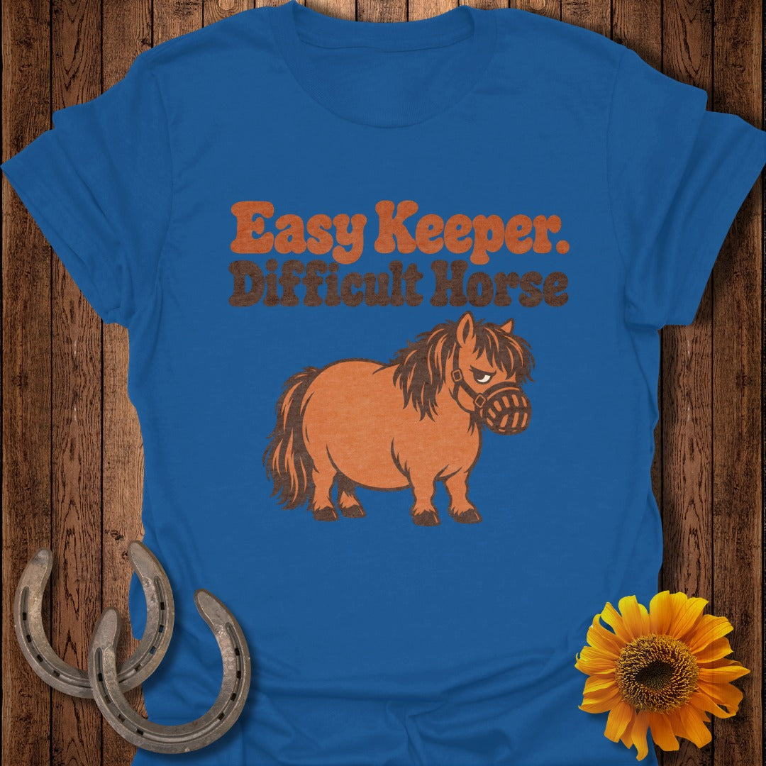 Blue t-shirt with "Easy Keeper. Difficult Horse" text and an angry pony graphic.