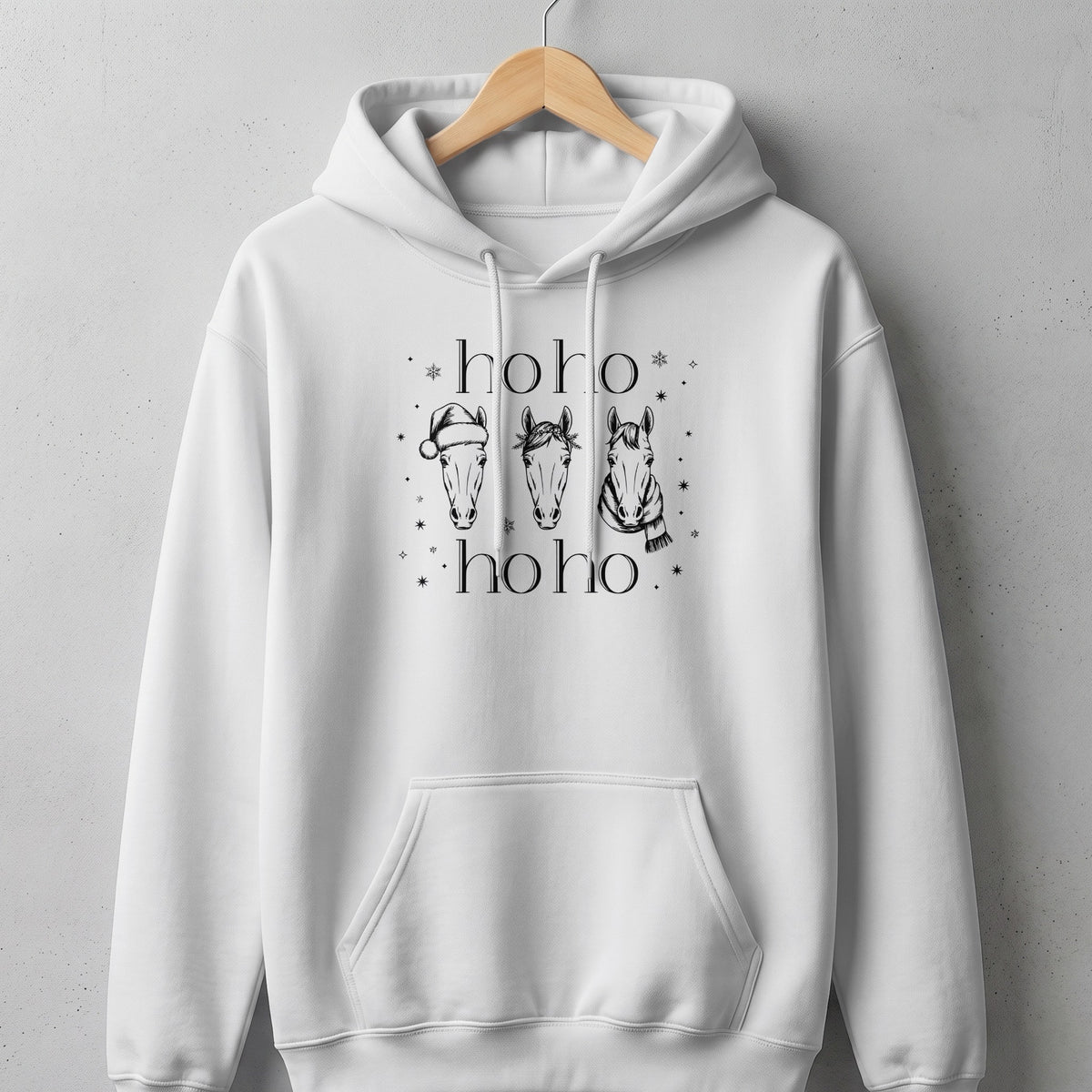 White hoodie with three horses wearing holiday accessories and "hoho hoho" text.