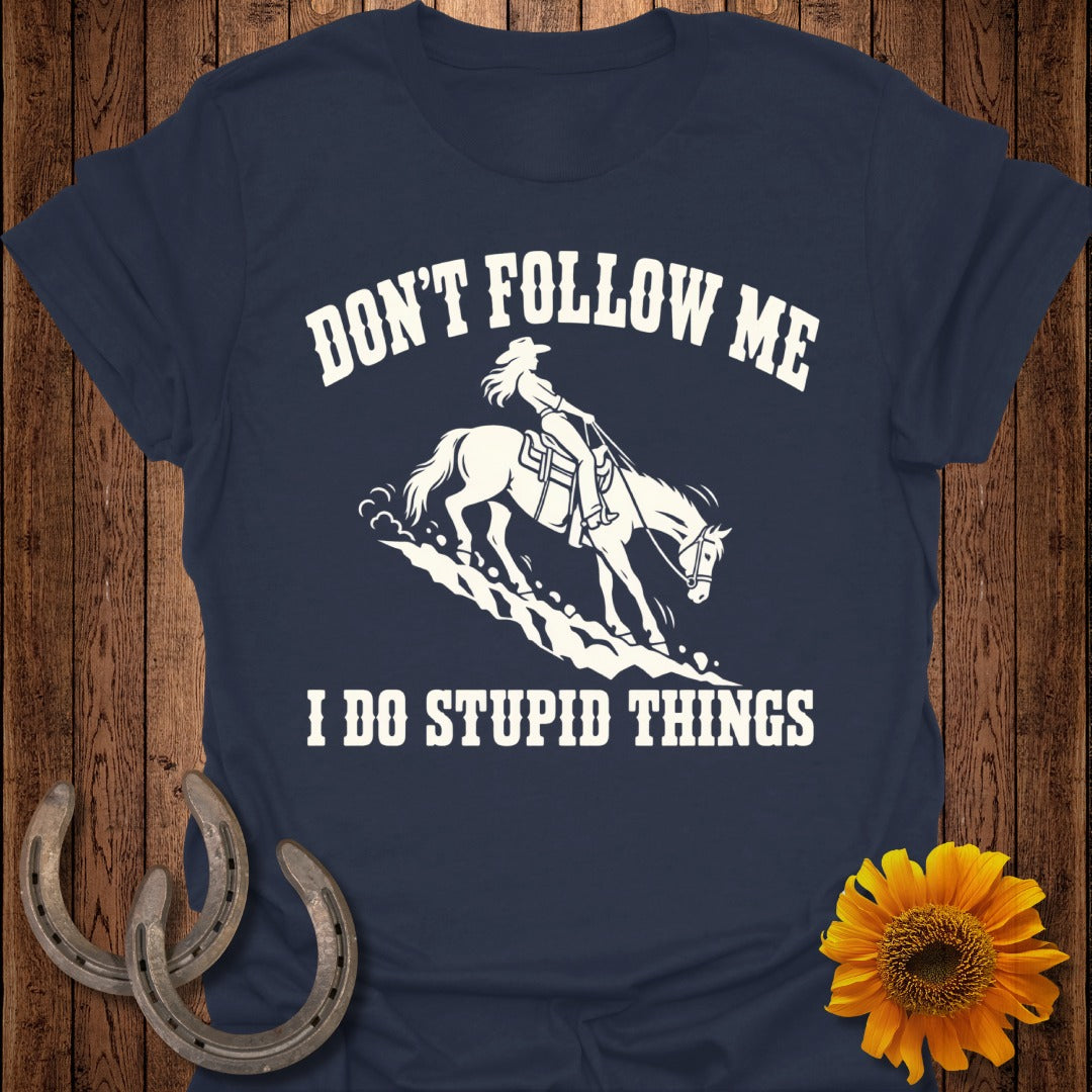 Navy t-shirt with white graphic of a woman on a horse and text: "Don't follow me, I do stupid things."