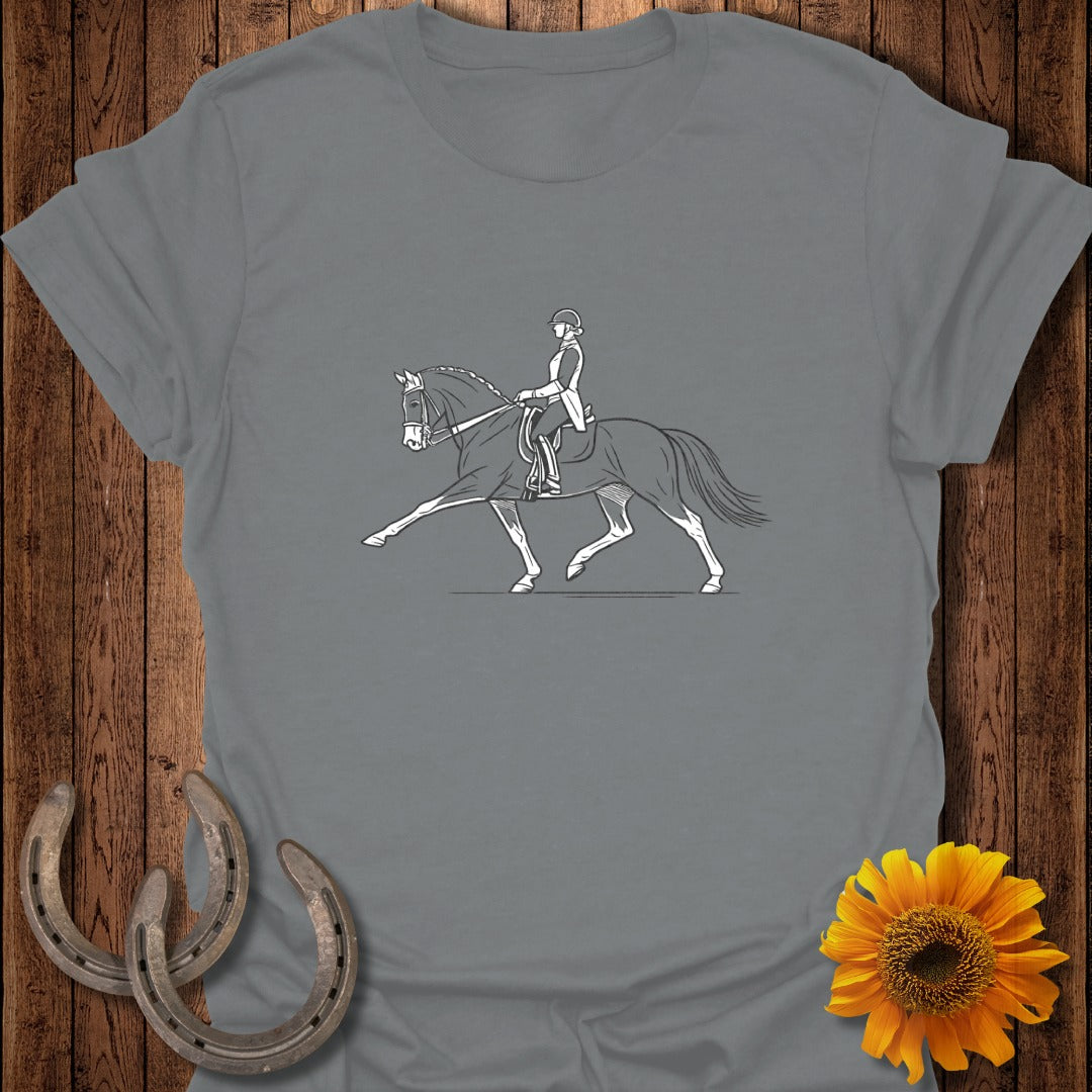 Line drawing of a dressage rider and horse on a grey t-shirt.