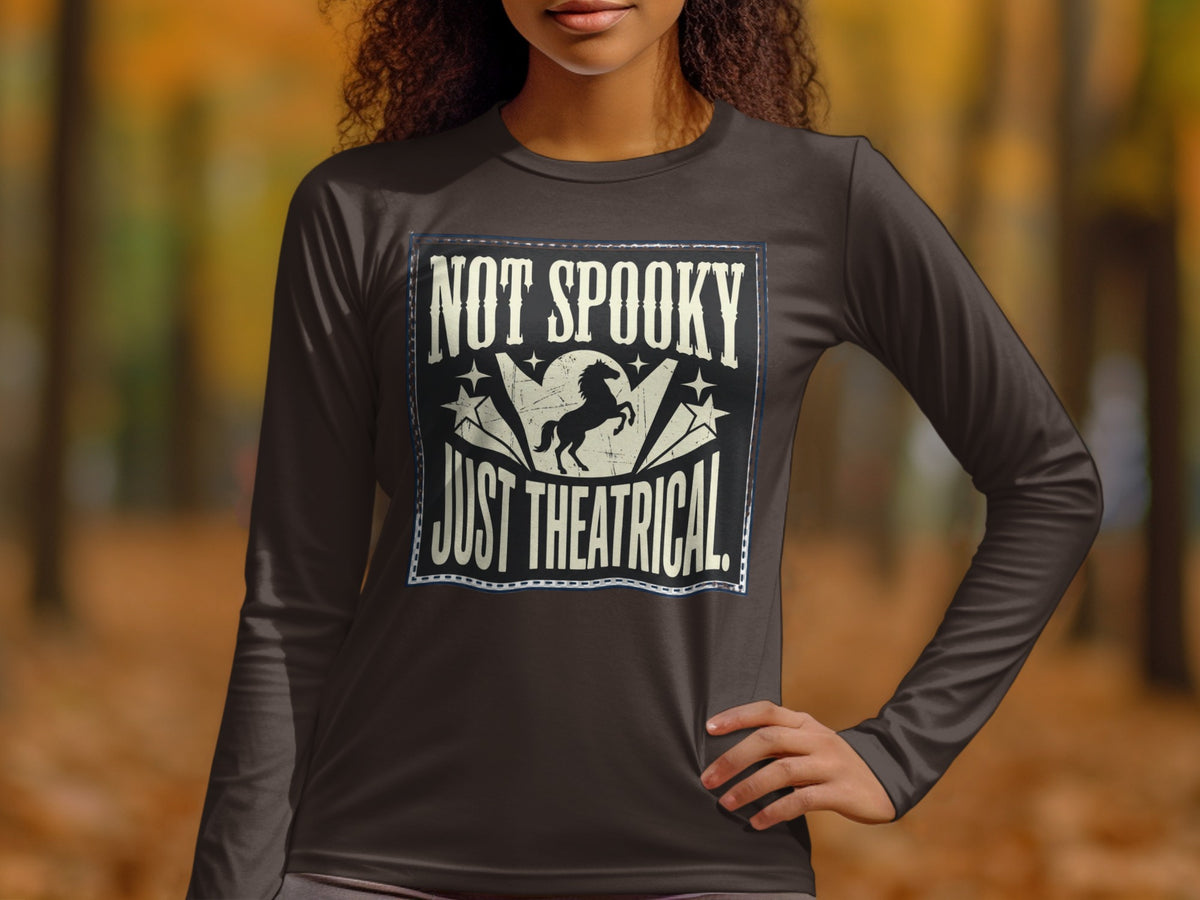 Long sleeve shirt with "NOT SPOOKY JUST THEATRICAL" text and a rearing horse graphic.
