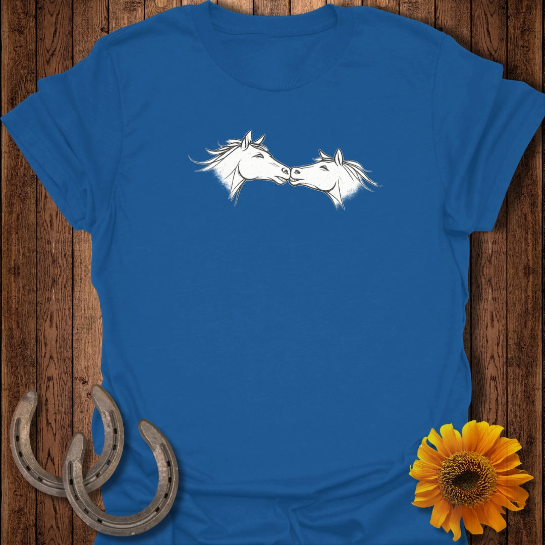 Blue t-shirt with two white horses nuzzling.