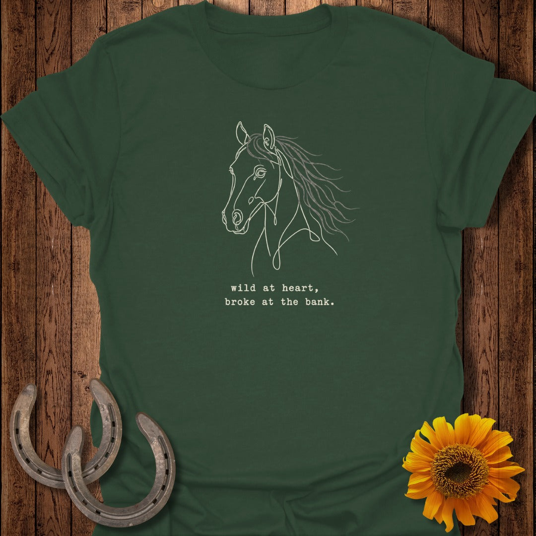 Green t-shirt with line art horse and text "wild at heart, broke at the bank."