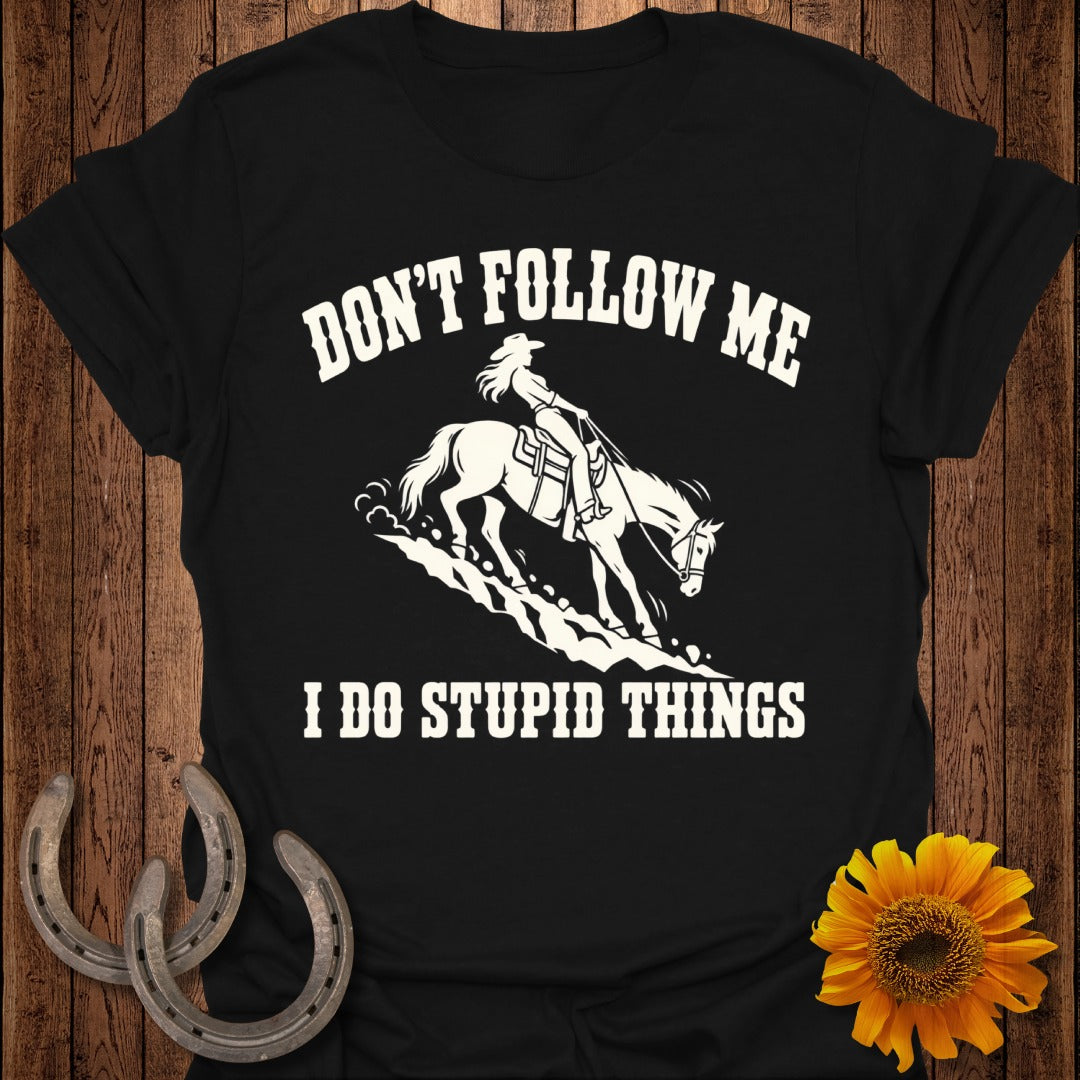 Black t-shirt with white text and graphics of a woman riding a horse.