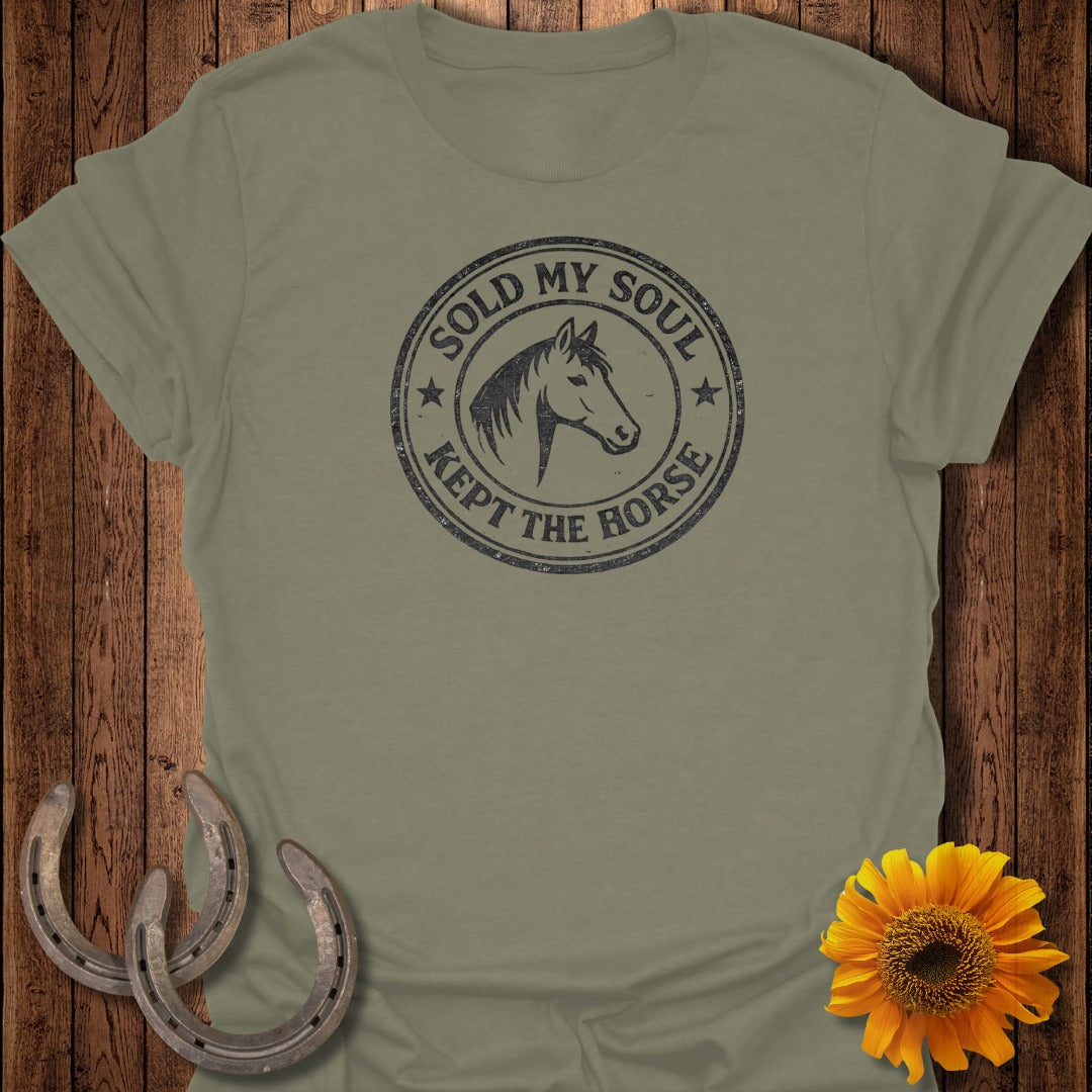 Olive t-shirt with distressed circular graphic: "SOLD MY SOUL KEPT THE HORSE", horse head.