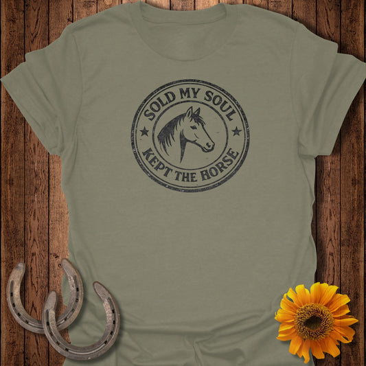 Olive t-shirt with distressed circular graphic: "SOLD MY SOUL KEPT THE HORSE", horse head.