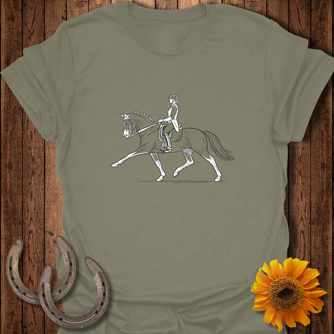 Line drawing of a dressage rider and horse performing a movement on a green t-shirt.