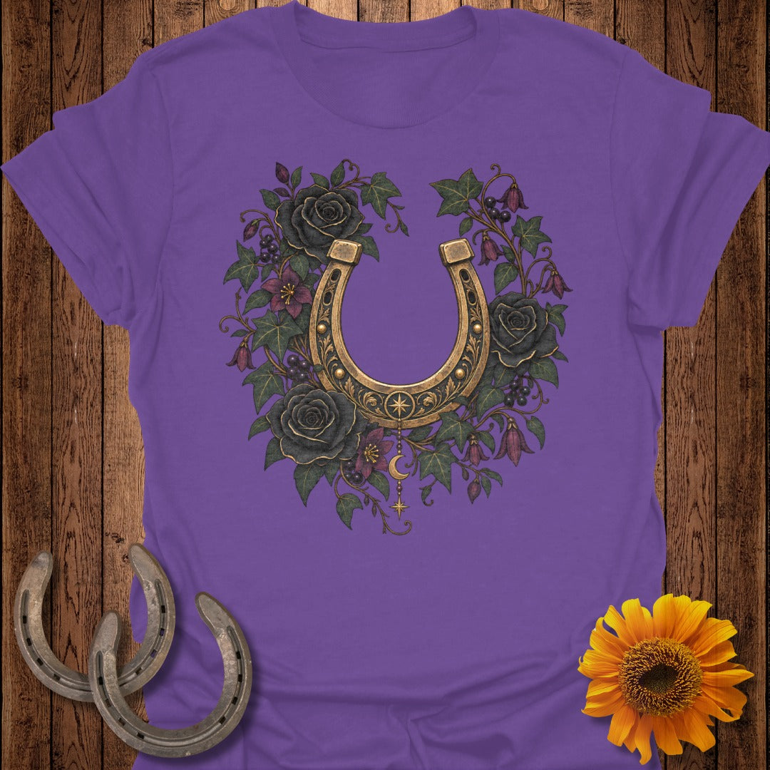 Purple t-shirt with a golden horseshoe, black roses, and gothic floral design.