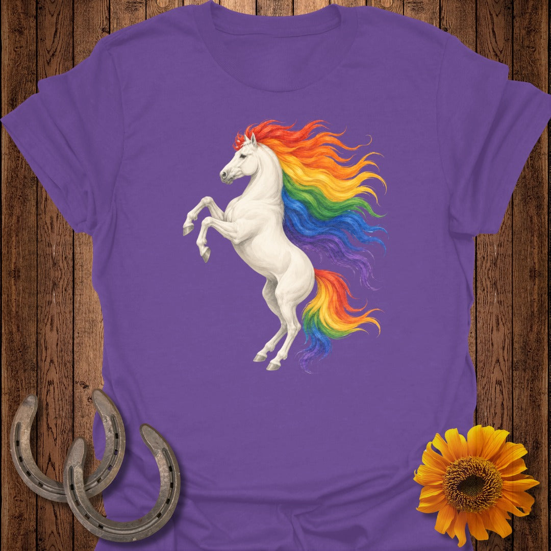 White unicorn with rainbow mane rearing up on purple t-shirt.
