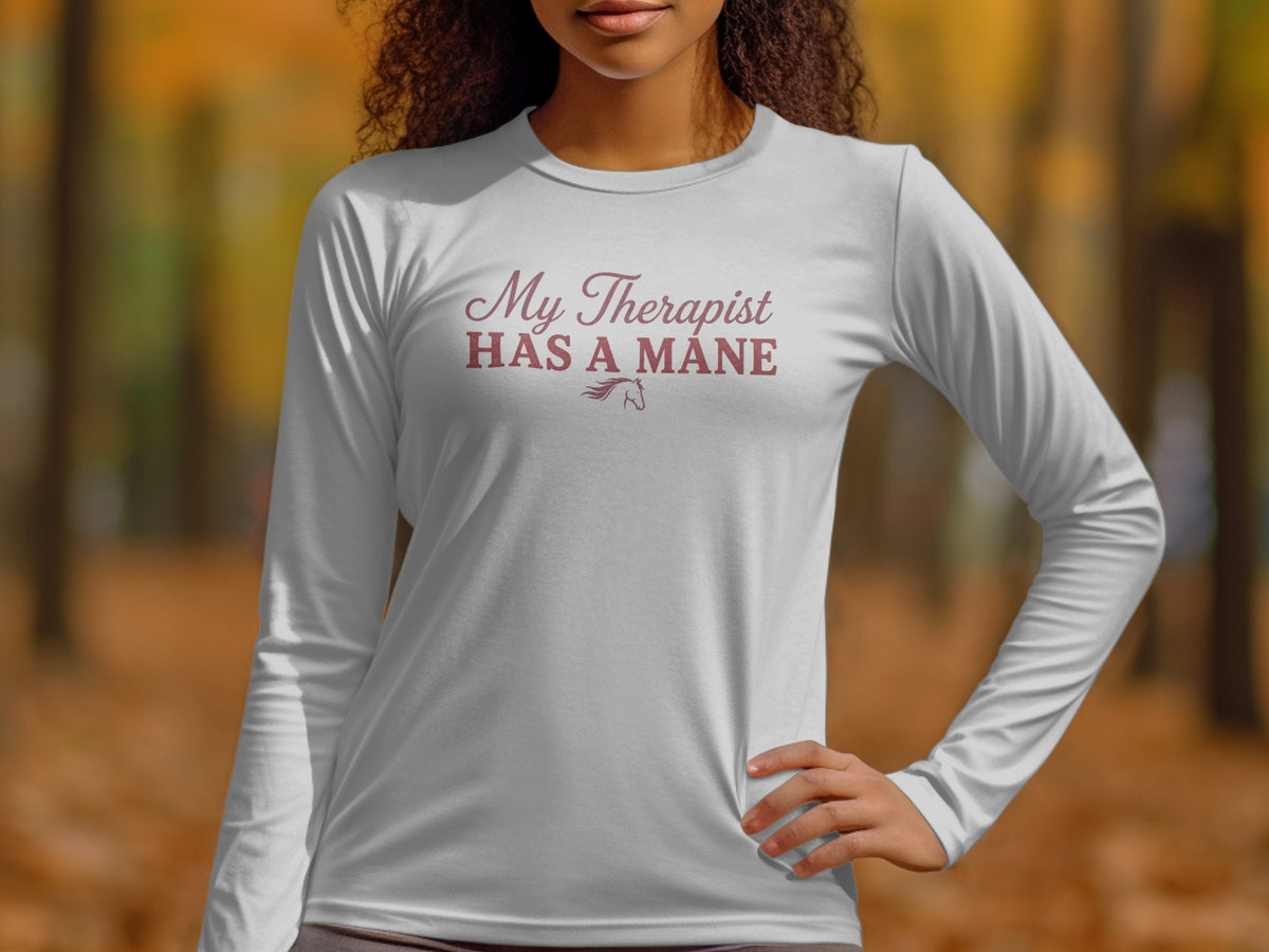 White long-sleeved shirt with burgundy text: "My Therapist HAS A MANE" and horse graphic.