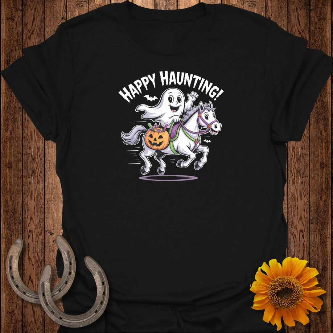 Black t-shirt with cartoon ghost riding white horse carrying pumpkin, text Happy Haunting!