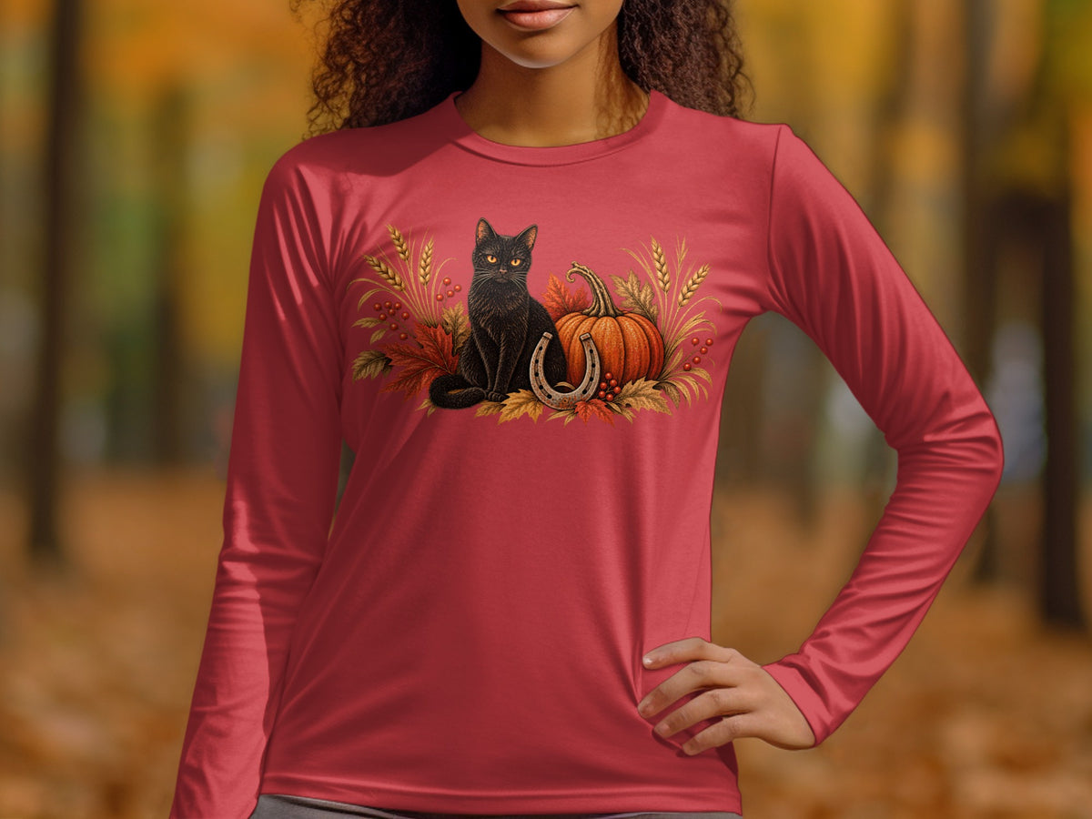 Red long-sleeved shirt with black cat, pumpkin, horseshoe, and autumn foliage design.