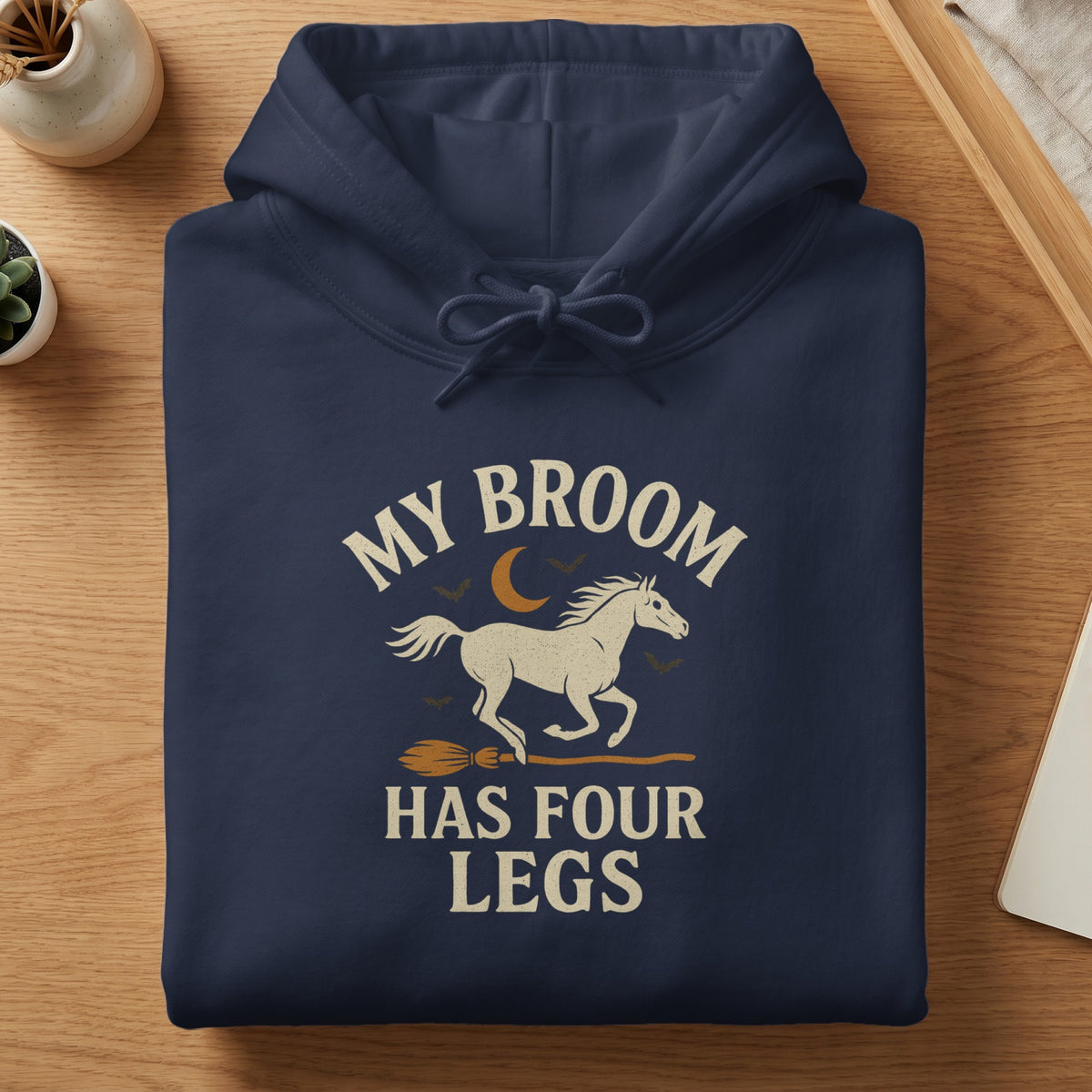 Navy hoodie with "My Broom Has Four Legs" text, horse, moon, bats, and broom graphic.
