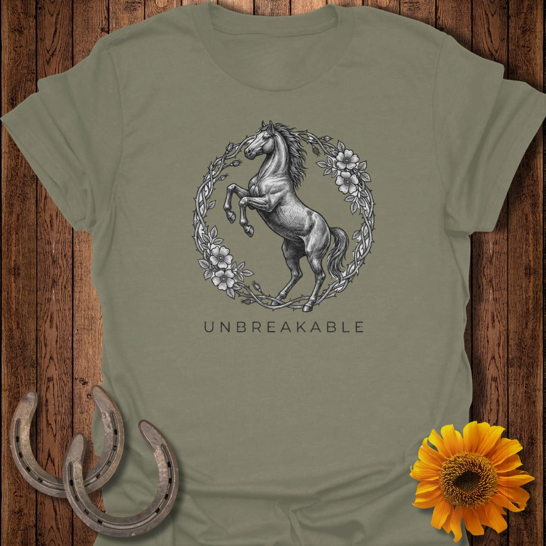 T-shirt with a horse in a floral wreath and "UNBREAKABLE" text.