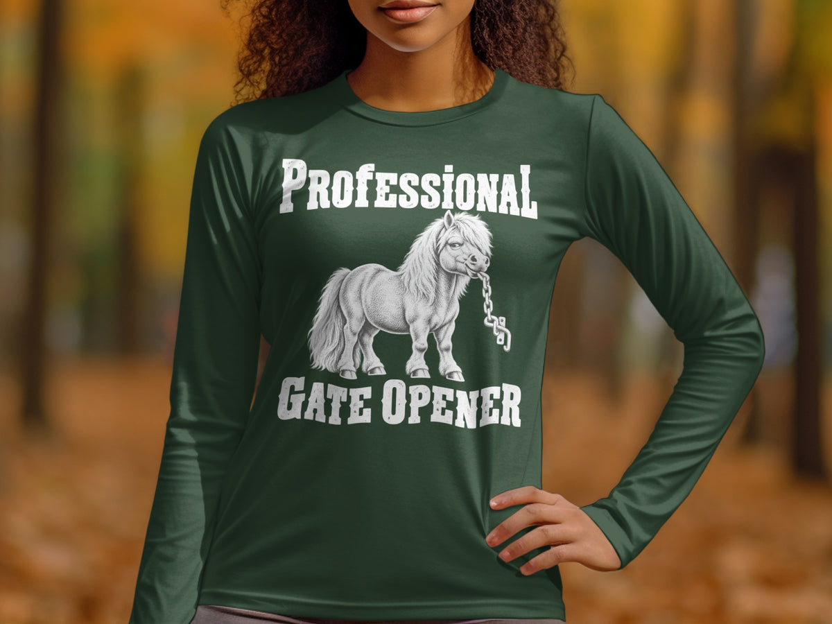 A person wears a dark green long-sleeved shirt featuring a graphic of a pony biting a chain with the text Professional Gate Opener.