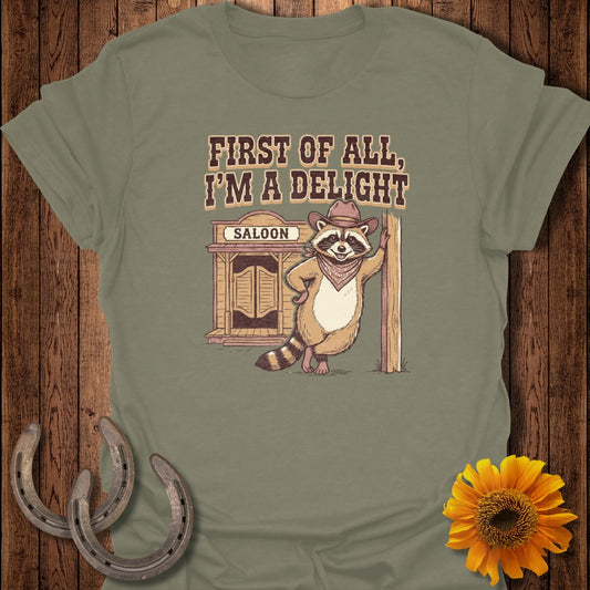 Raccoon in cowboy hat leaning against saloon, shirt text: FIRST OF ALL, I'M A DELIGHT.