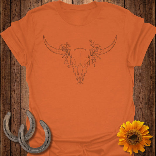 Orange t-shirt with a line drawing of a bull skull and floral accents.