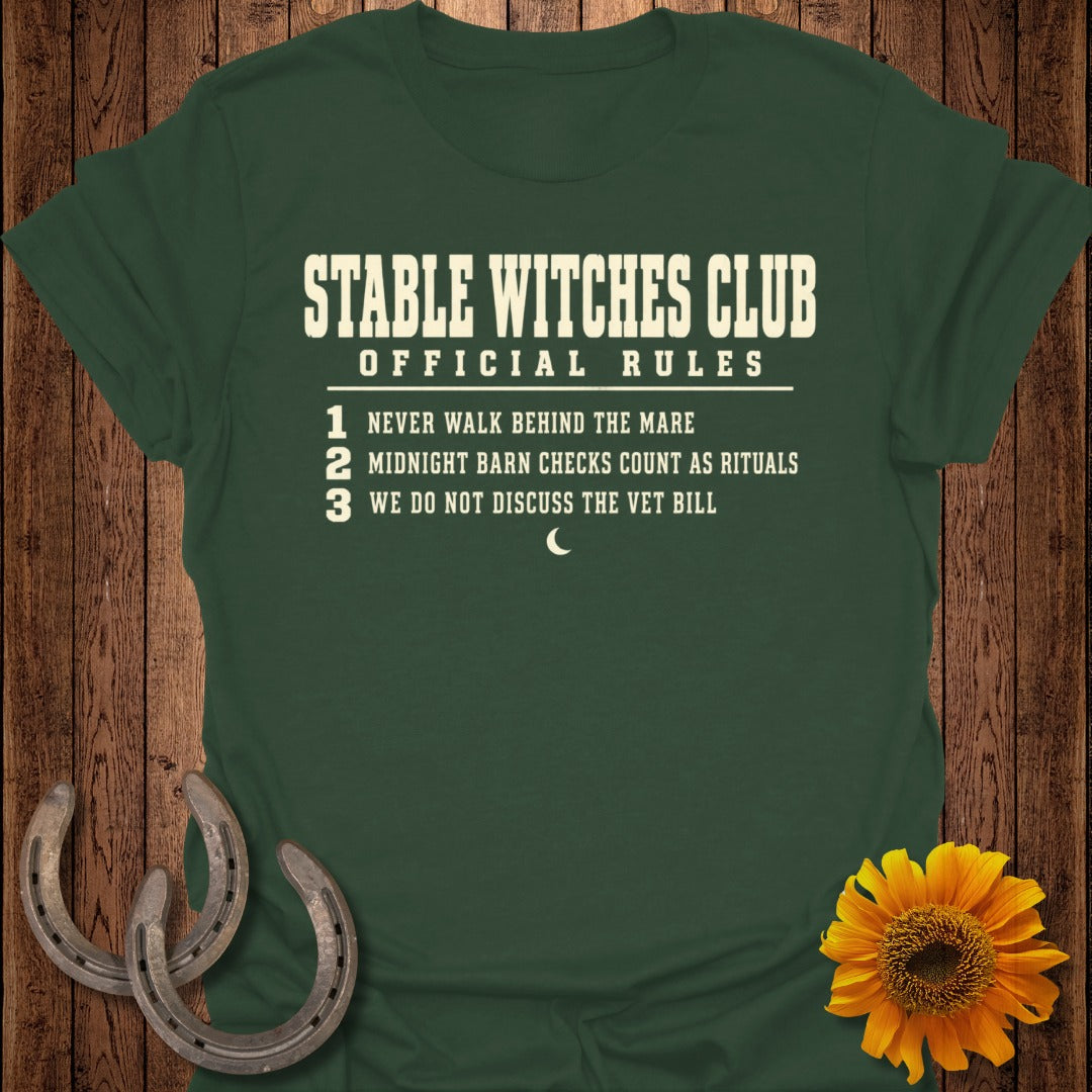 Green t-shirt with "Stable Witches Club Official Rules" and three rules.
